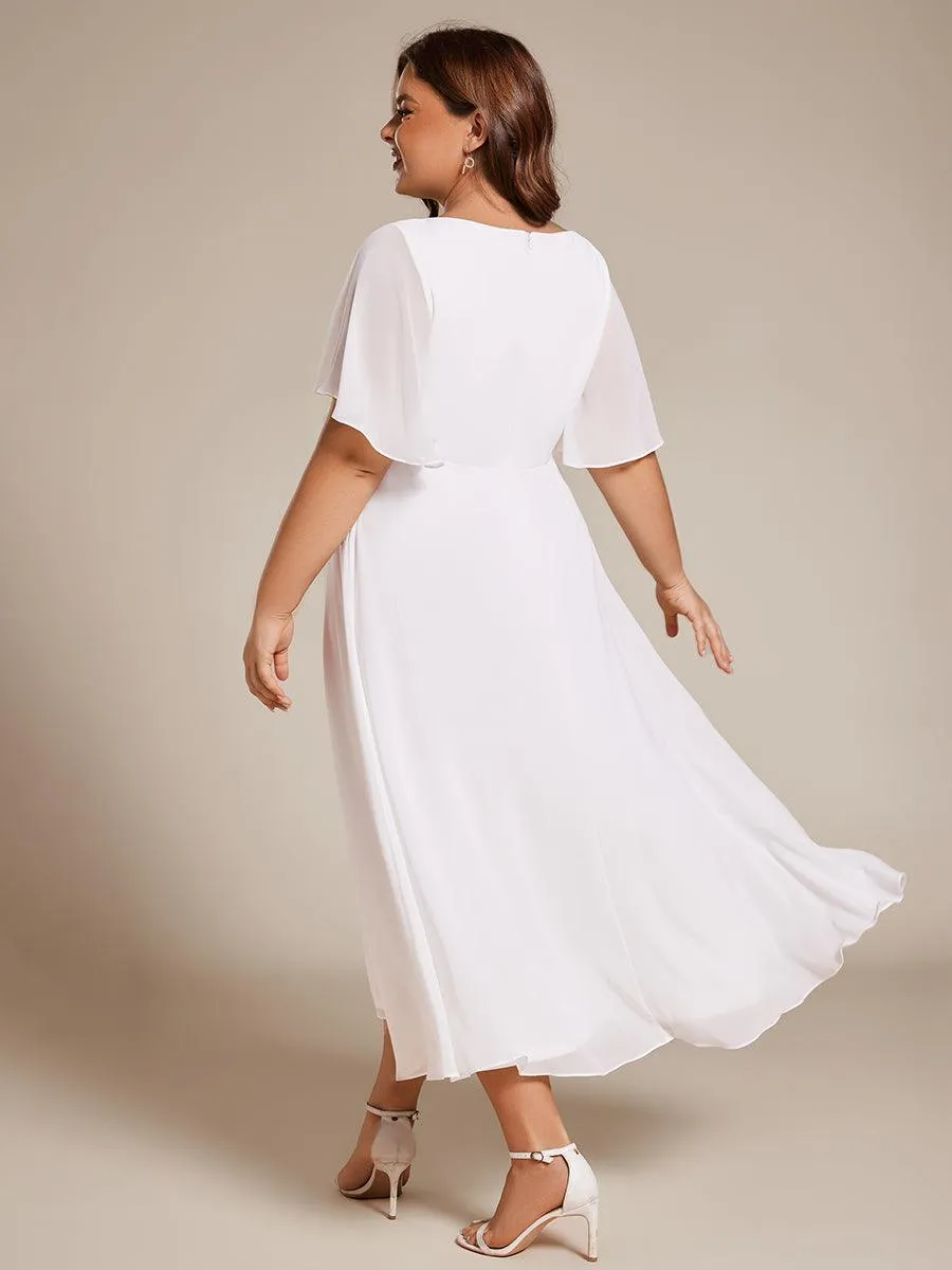 Robe d'invité de mariage mi-longue en mousseline à col en V avec appliques à la taille